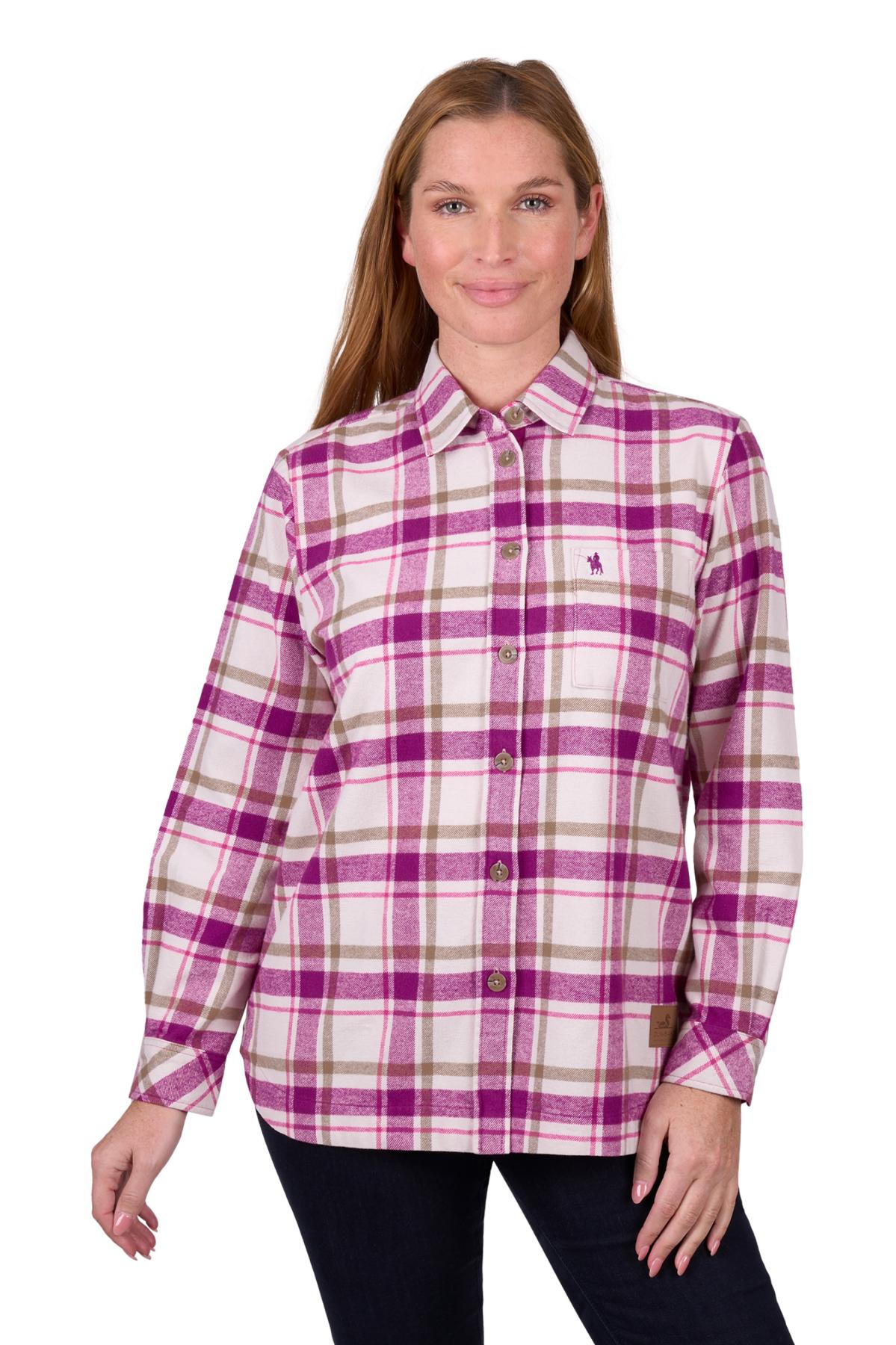A woman wearing a long sleeve flannel shirt with a checkered pattern in pink, purple, and green colors.